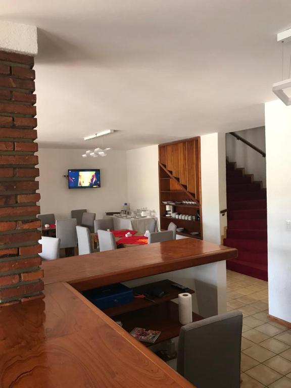 a dining room with a table and chairs at Ambientes de la Patagonia in Winifreda