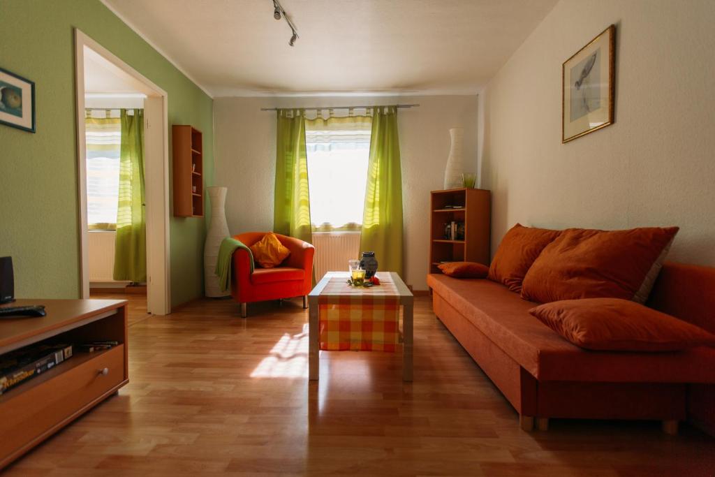 a living room with a couch and a table at flat2let Apartment 1 in Frankfurt/Main