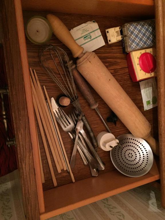 a drawer filled with different types of utensils at Les Galets in Tracy-sur-Mer