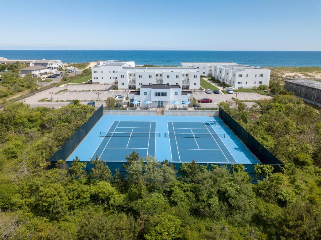 an overhead view of a tennis court near the ocean at The Hermitage at Napeague in Amagansett