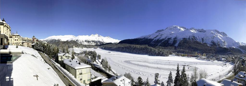 a view of a snow covered mountain with a ski slope at Chesa Residence in St. Moritz