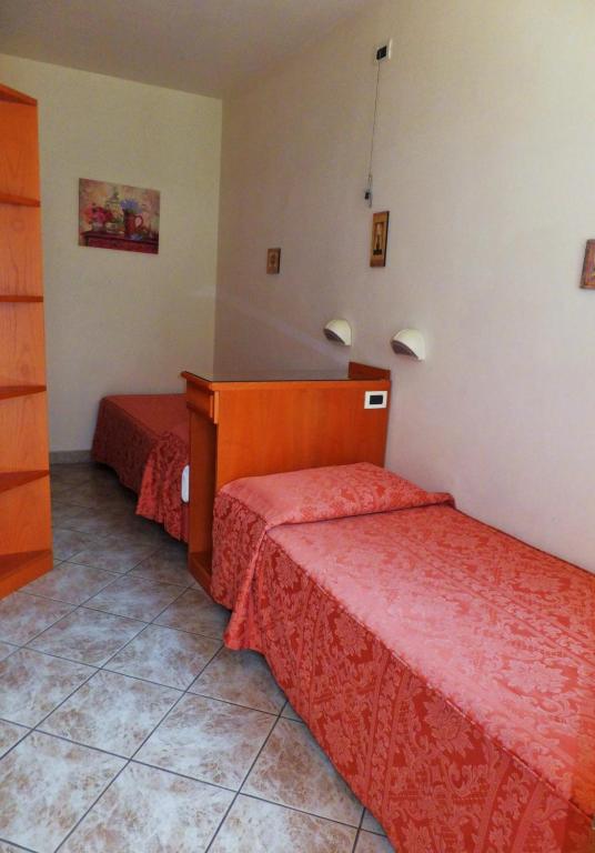 Postel nebo postele na pokoji v ubytování Hotel Bella Riviera Lungomare