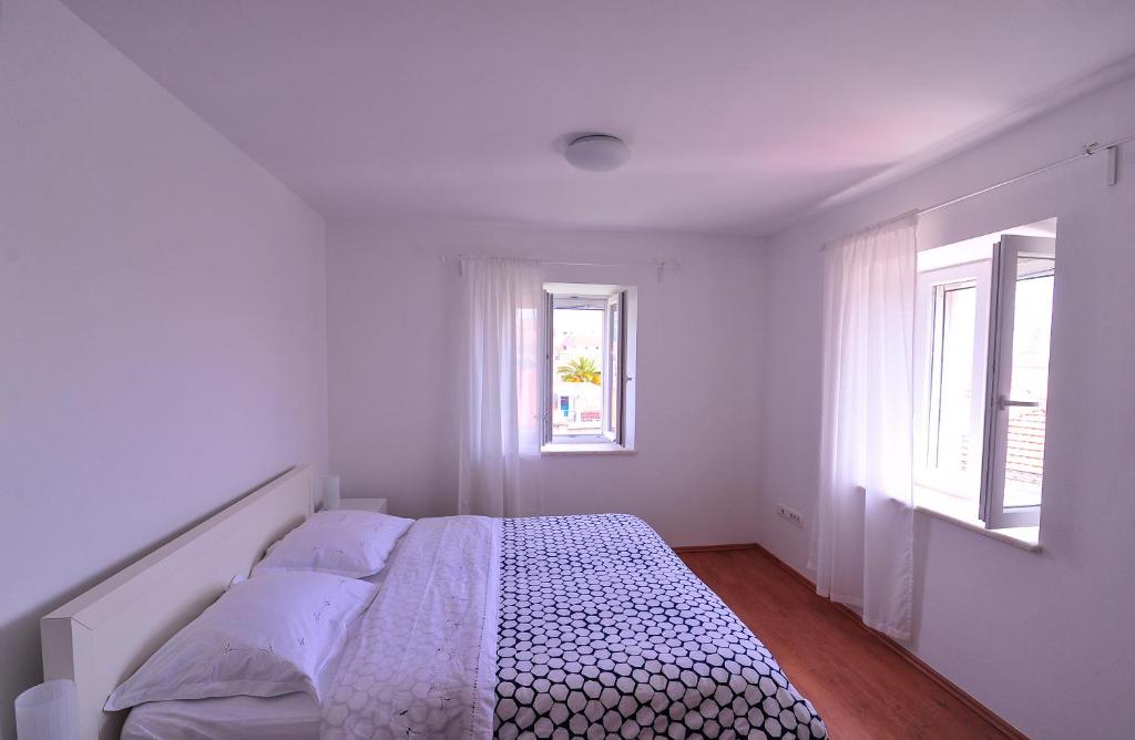 Posteľ alebo postele v izbe v ubytovaní Apartments An Ni