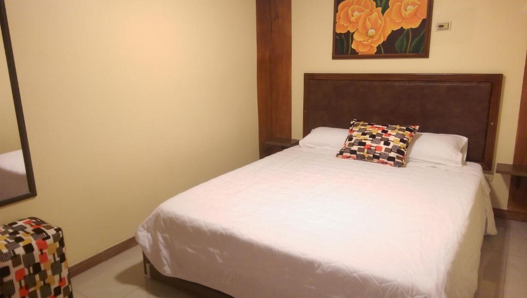 Postel nebo postele na pokoji v ubytování Hotel Bonanza
