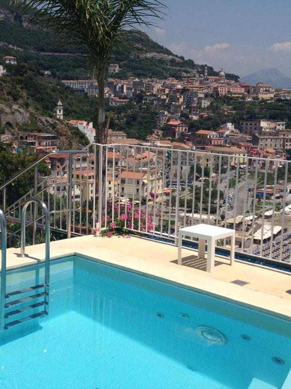 a swimming pool with a view of a city at Hotel Voce del Mare in Vietri sul Mare