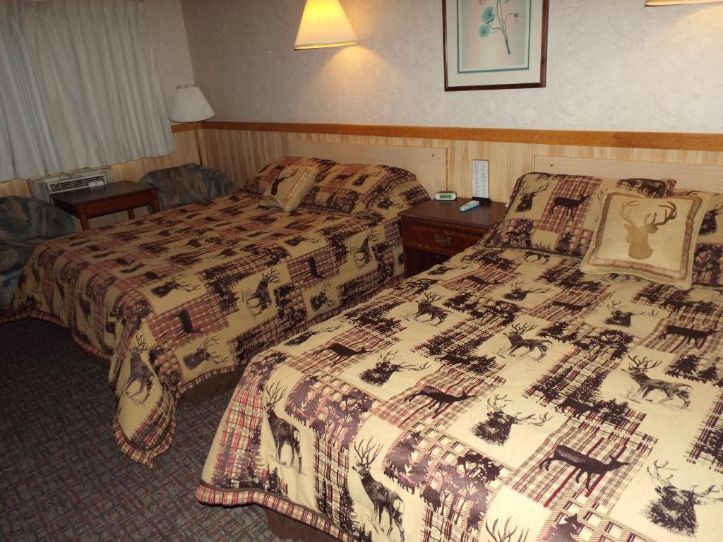 a hotel room with two beds in a room at Caboose Motel in Libby