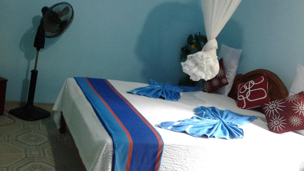 Postel nebo postele na pokoji v ubytování Flower Inn