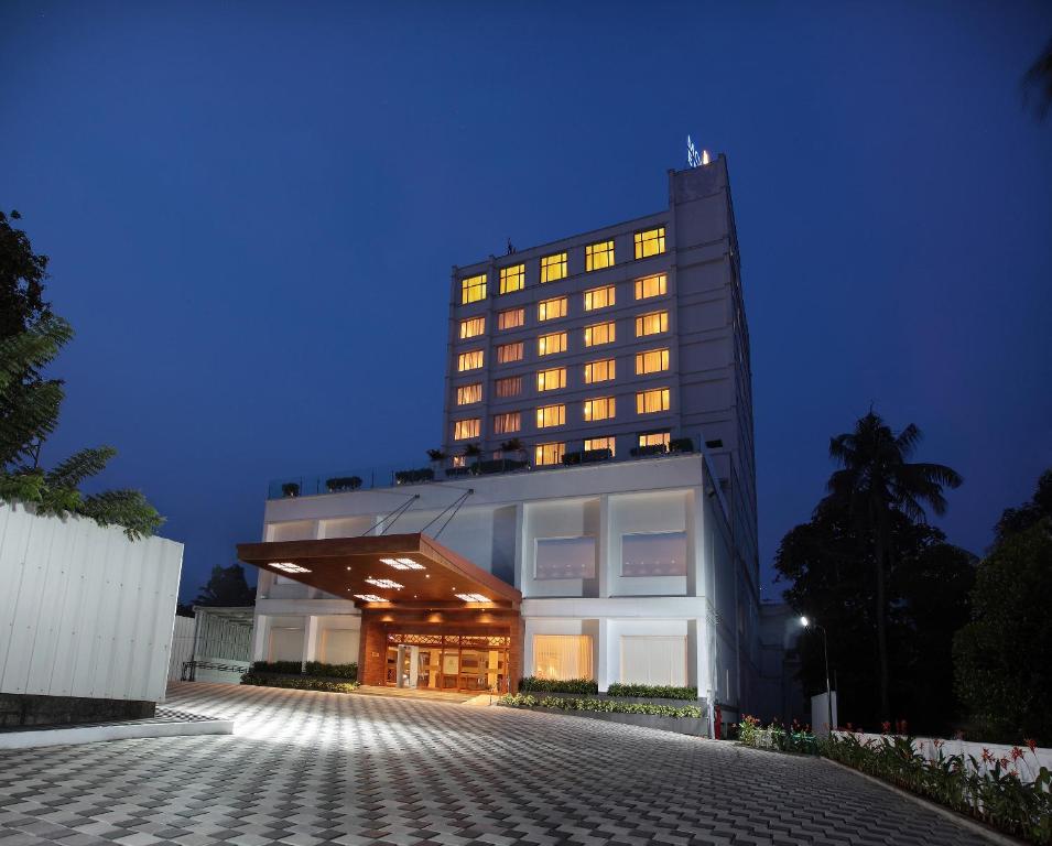 a building with its lights on at night at Monsoon Empress Kochi in Cochin