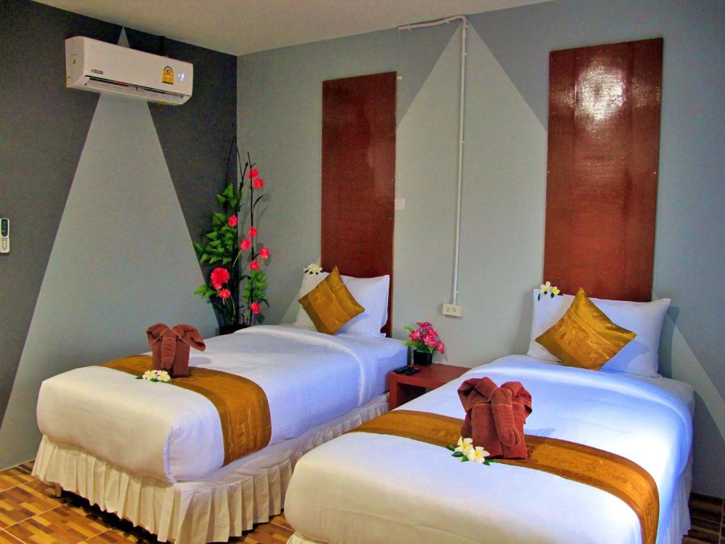 Postel nebo postele na pokoji v ubytování Chawlay Resort Koh Lipe