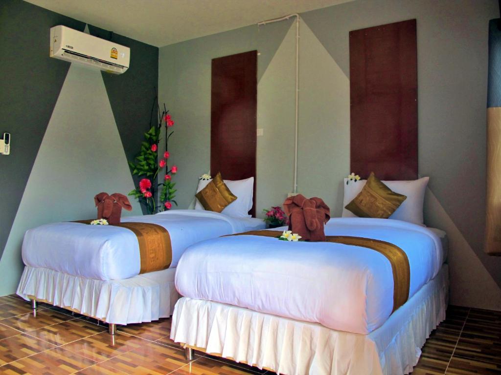Postel nebo postele na pokoji v ubytování Chawlay Resort Koh Lipe