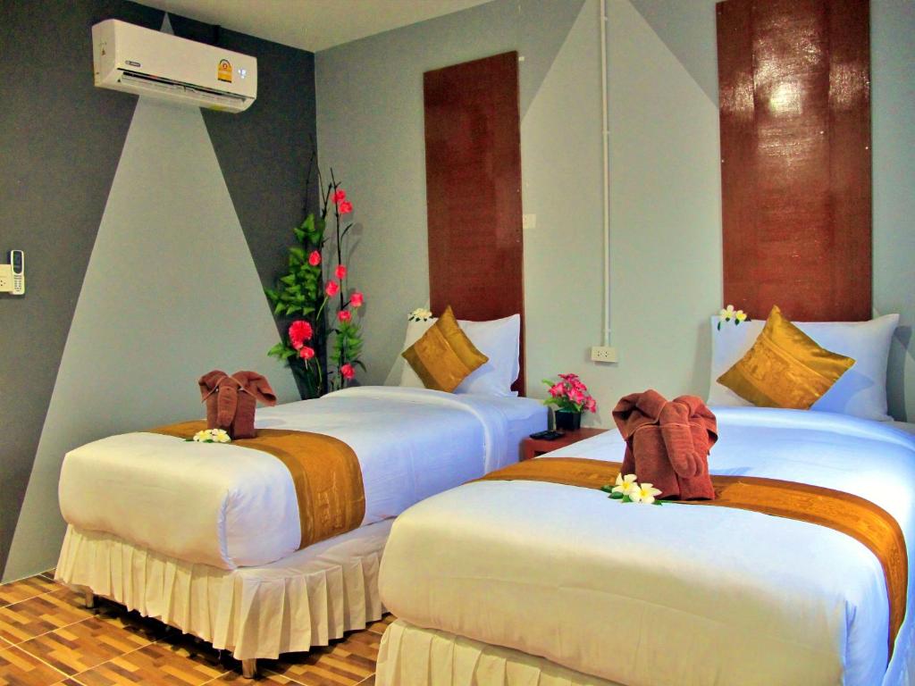 Postel nebo postele na pokoji v ubytování Chawlay Resort Koh Lipe