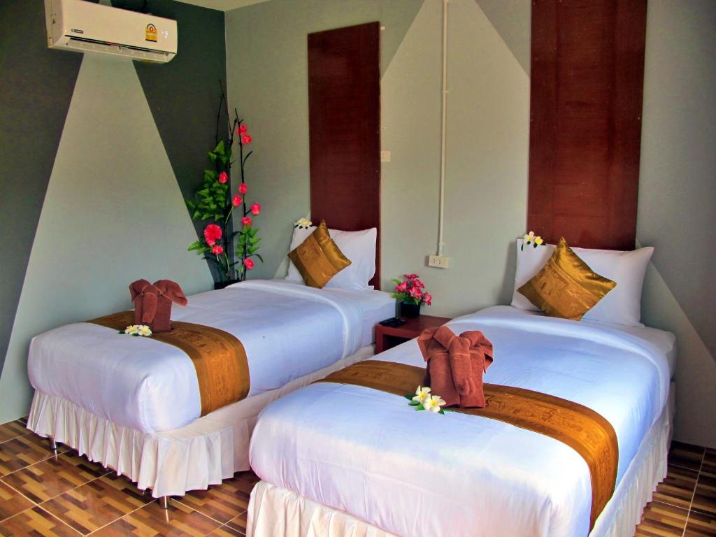Postel nebo postele na pokoji v ubytování Chawlay Resort Koh Lipe