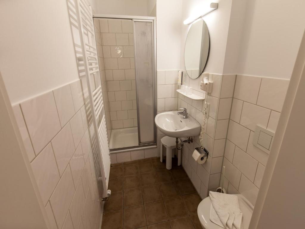 Koupelna v ubytování Hotel Weisse Düne