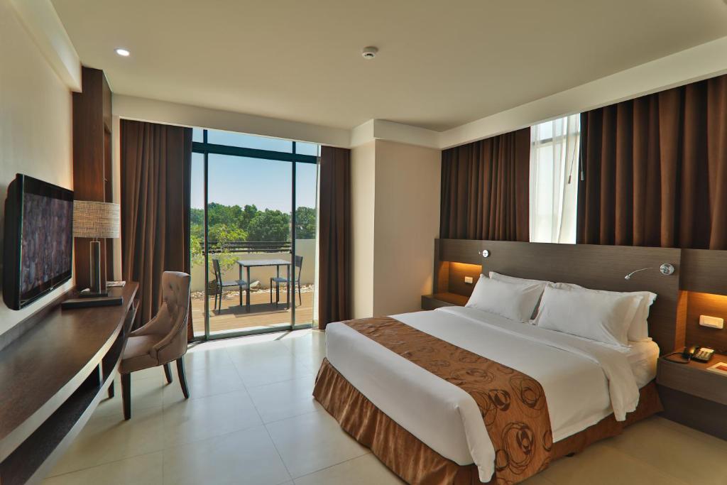Postel nebo postele na pokoji v ubytování Kew Hotel Tagbilaran