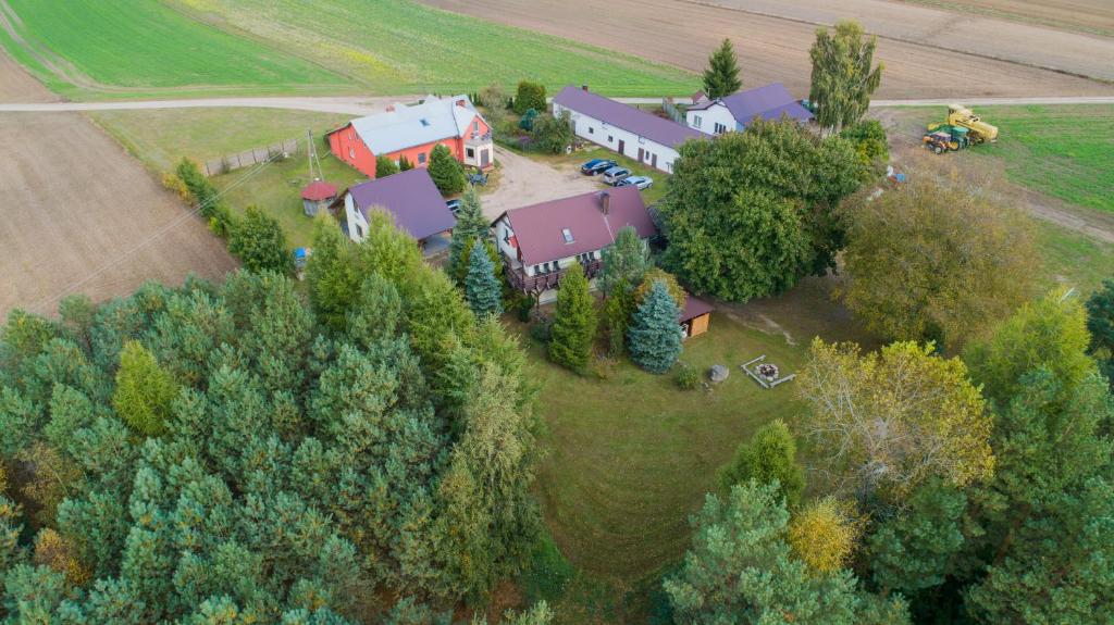 an aerial view of a house with a farm at Agroturystyka na Kaszubach in Lipnica