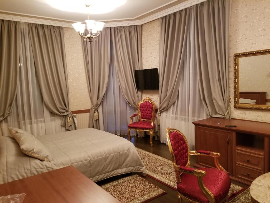 TV a/nebo společenská místnost v ubytování Vila Sigal Pogradec
