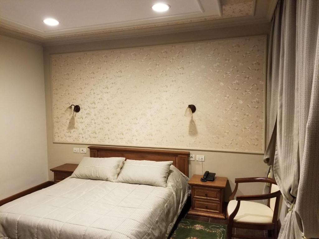 Postel nebo postele na pokoji v ubytování Vila Sigal Pogradec