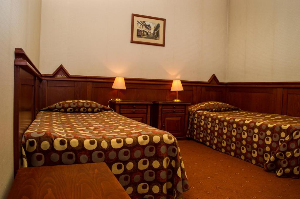 Postel nebo postele na pokoji v ubytování Hotel Central