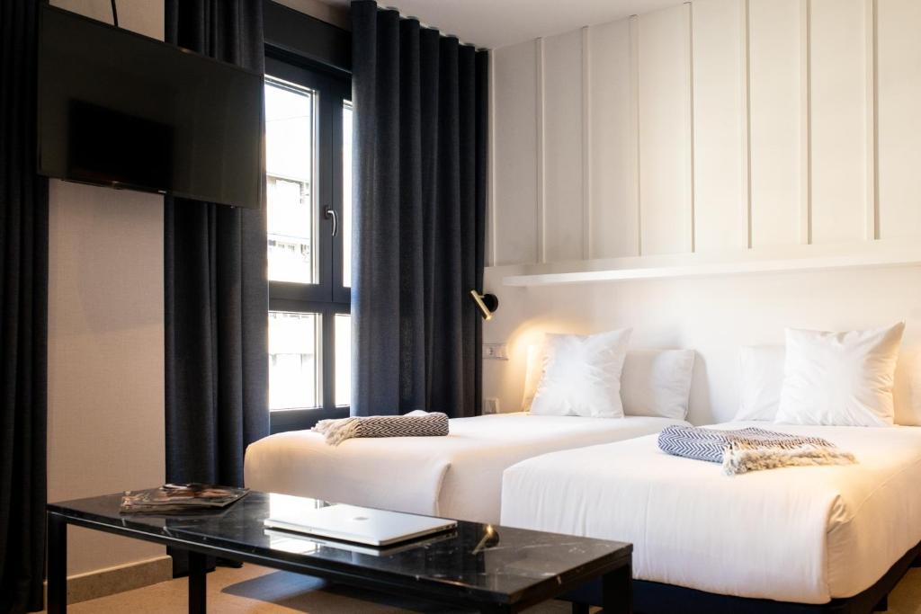 Letto o letti in una camera di Ramirez Flats Valencia