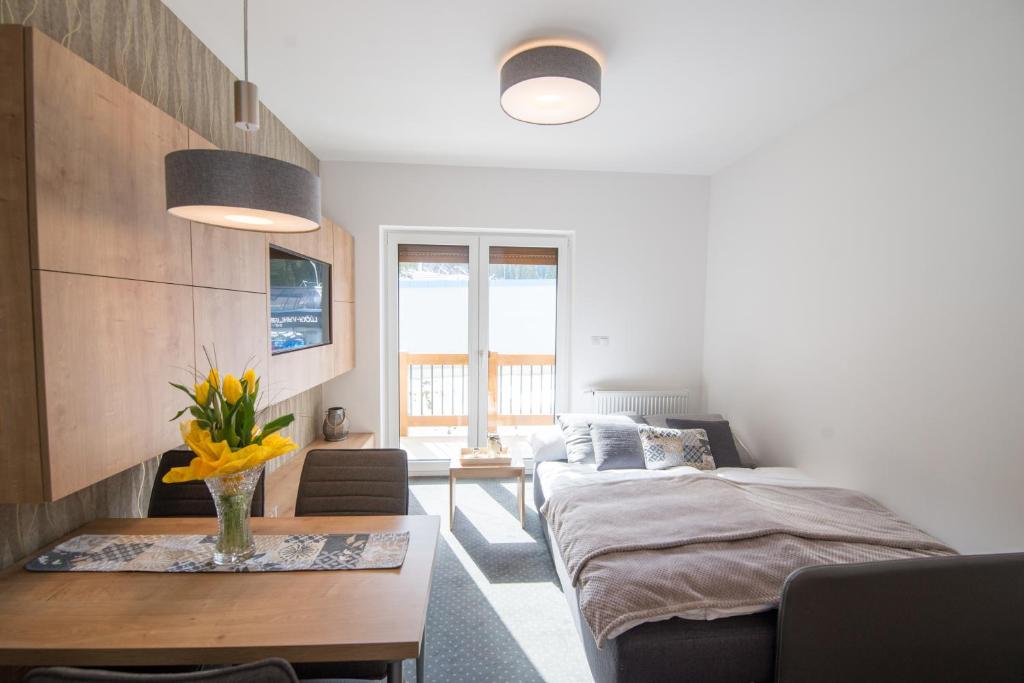 Postel nebo postele na pokoji v ubytování ff apartments Jasná Lúčky