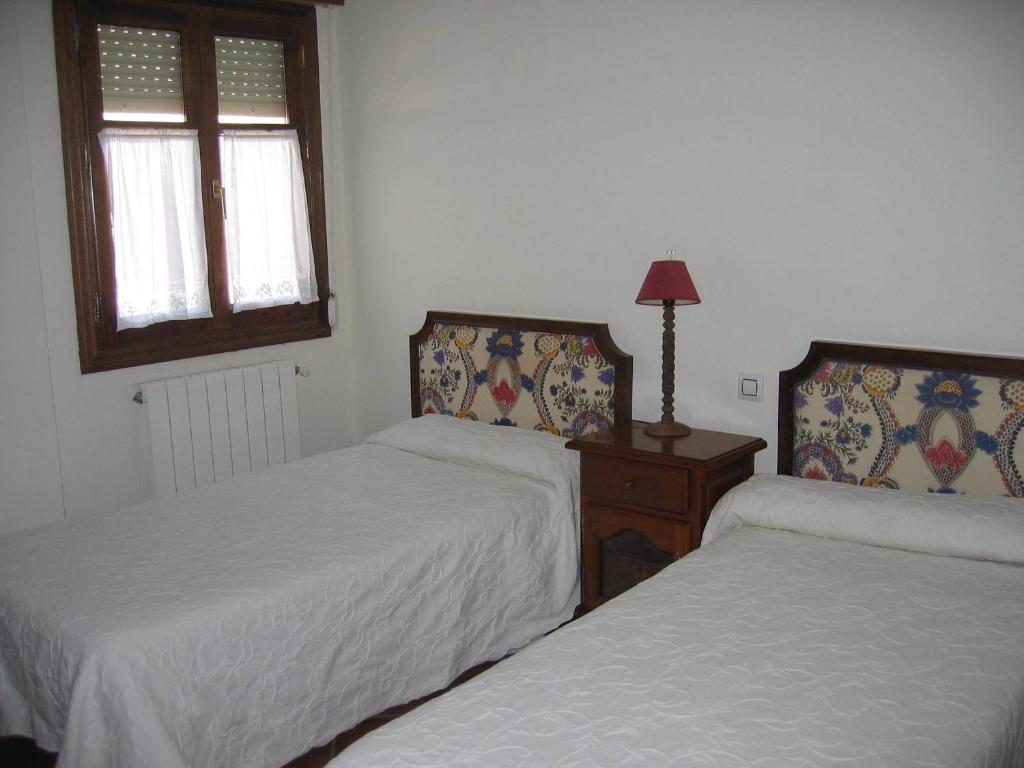 Postel nebo postele na pokoji v ubytování Apartamentos El Pajar del Abuelo