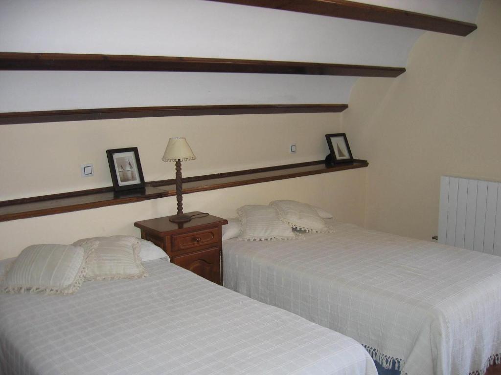 Postel nebo postele na pokoji v ubytování Apartamentos El Pajar del Abuelo