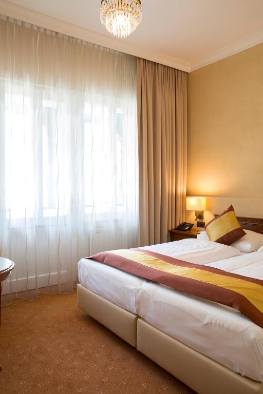 Postel nebo postele na pokoji v ubytování Hotel Sacher Baden