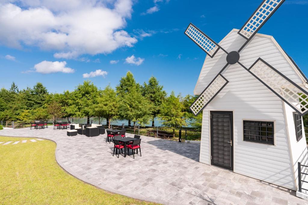a rendering of a windmill at a park at Follow the Cloud B&B in Jialin