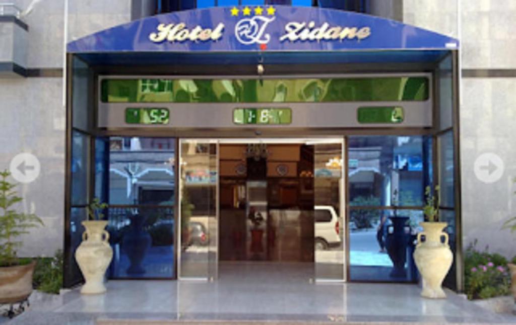 a store front of a building with a sign on it at HOTEL ZIDANE in Sétif