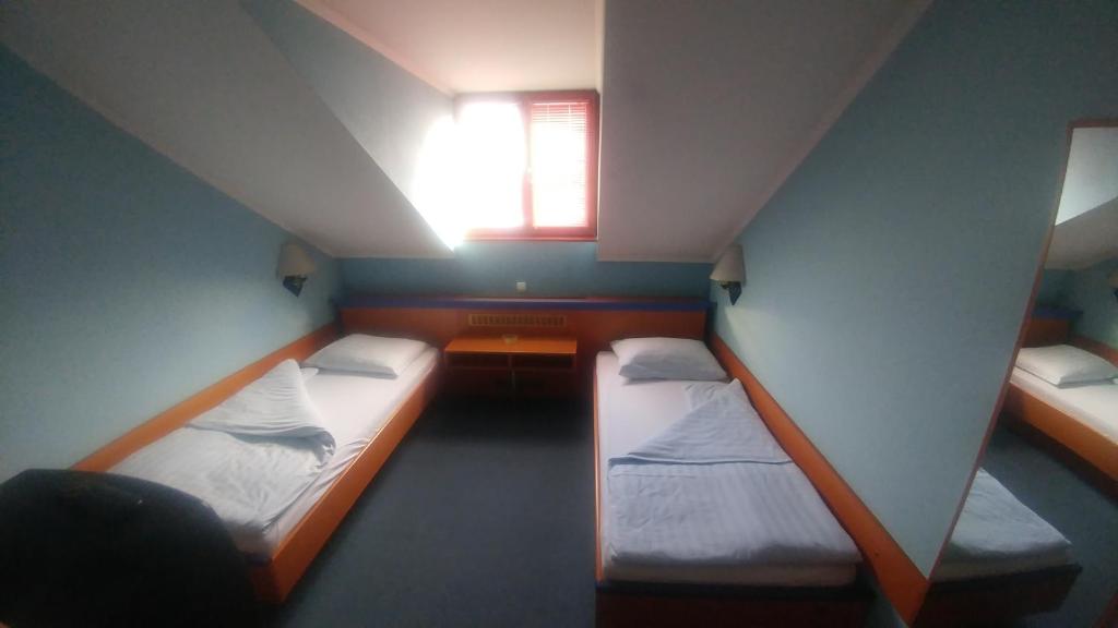 Postel nebo postele na pokoji v ubytování Hotel Delminium