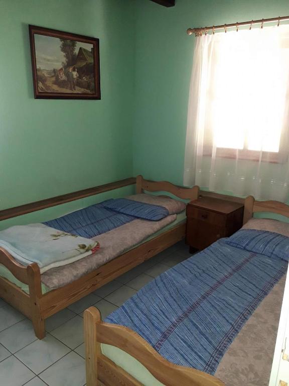 Posteľ alebo postele v izbe v ubytovaní Agroturystyka w ogrodach