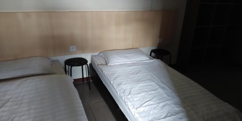 Postel nebo postele na pokoji v ubytování T Hotel