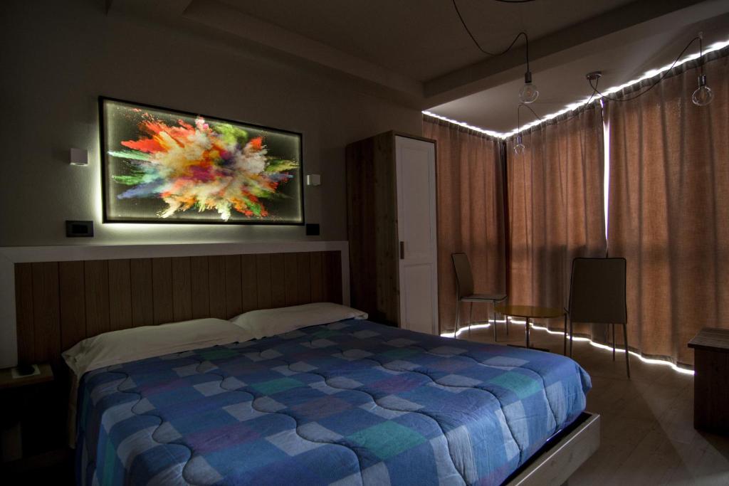 Posteľ alebo postele v izbe v ubytovaní Hotel Laghetto
