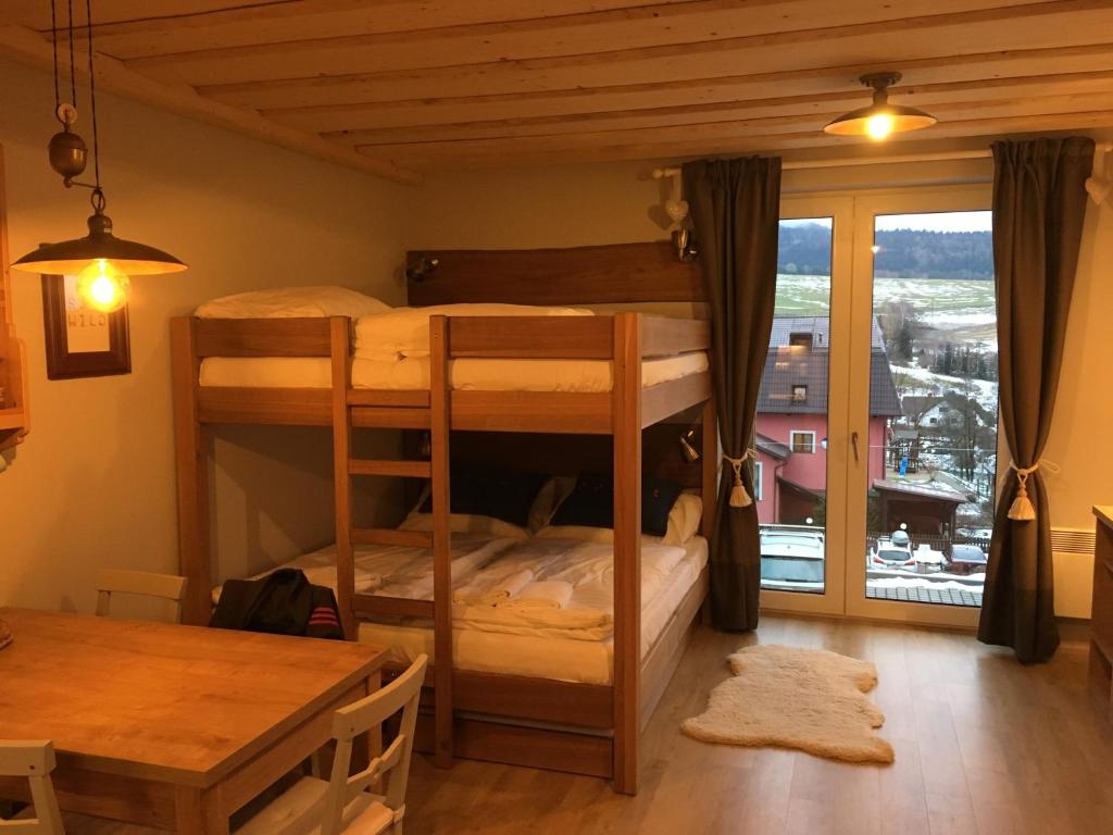 Postel nebo postele na pokoji v ubytování Apartmán u svahu Dolní Morava