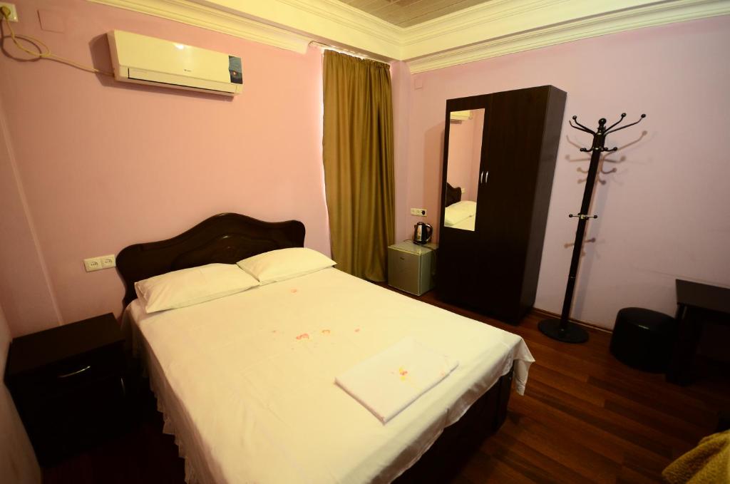 Postel nebo postele na pokoji v ubytování Hotel Peria