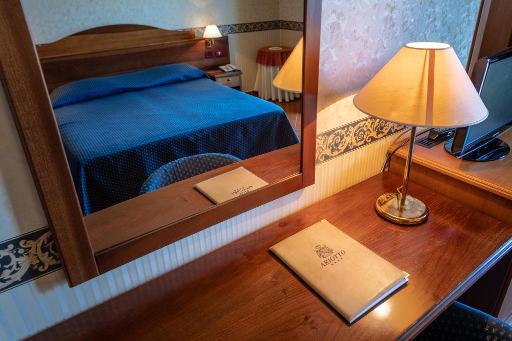 Postel nebo postele na pokoji v ubytování Ariotto Village