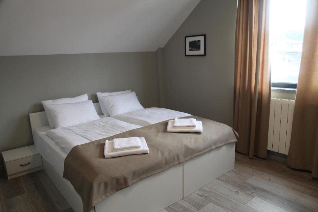 Кровать или кровати в номере Double House Bakuriani