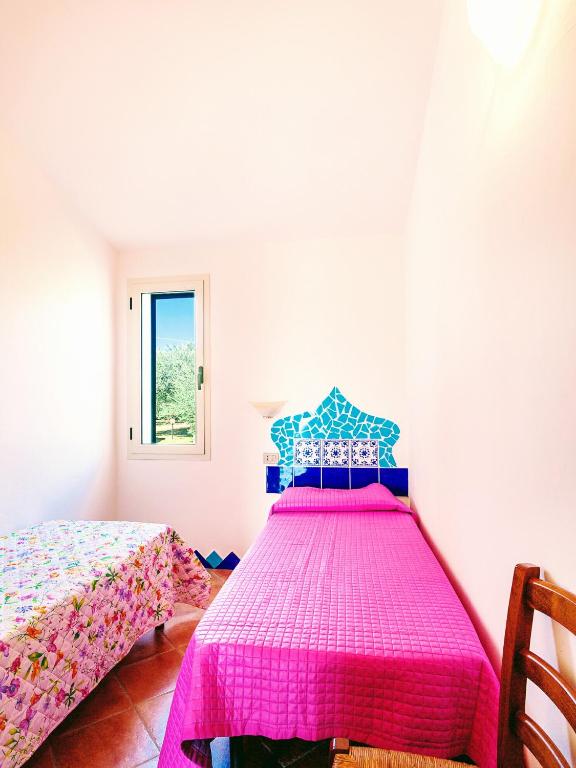 Postel nebo postele na pokoji v ubytování Orosei RE - Il Paradiso degli Ulivi con PISCINA e vista mare