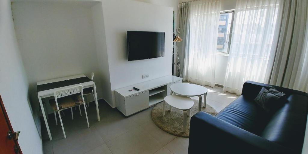 TV a/nebo společenská místnost v ubytování Begin19 Apartments & Hostel