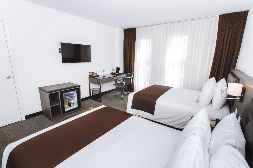 Krevet ili kreveti u jedinici u objektu Wyndham Costa del Sol Lima Airport