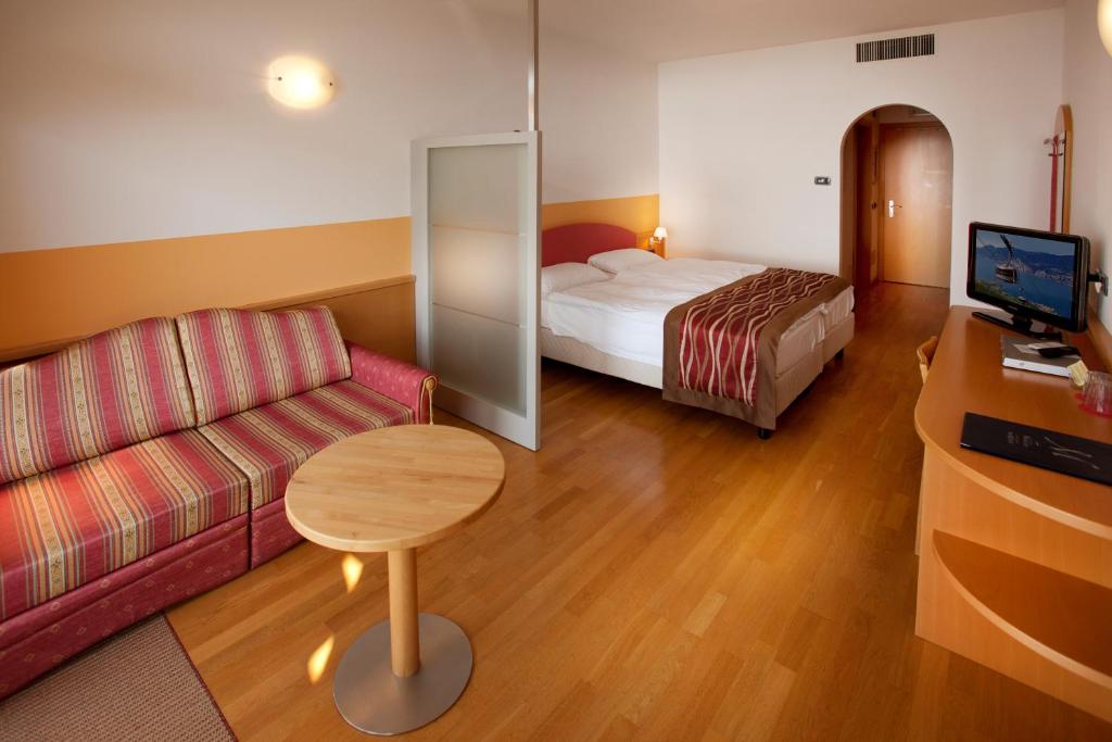 Postel nebo postele na pokoji v ubytování Hotel Baia Verde