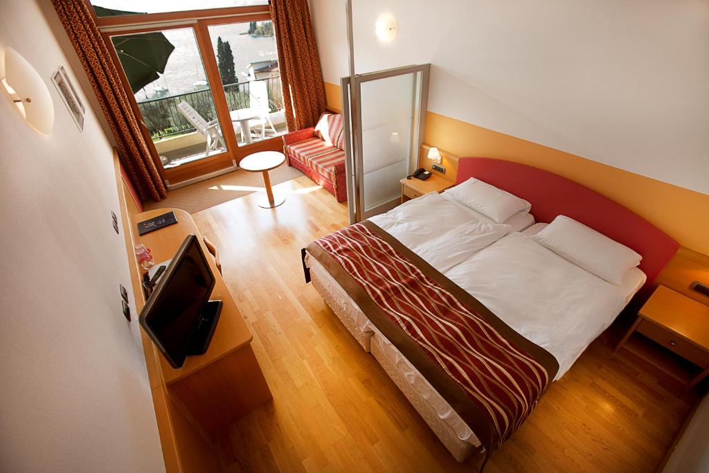 Postel nebo postele na pokoji v ubytování Hotel Baia Verde