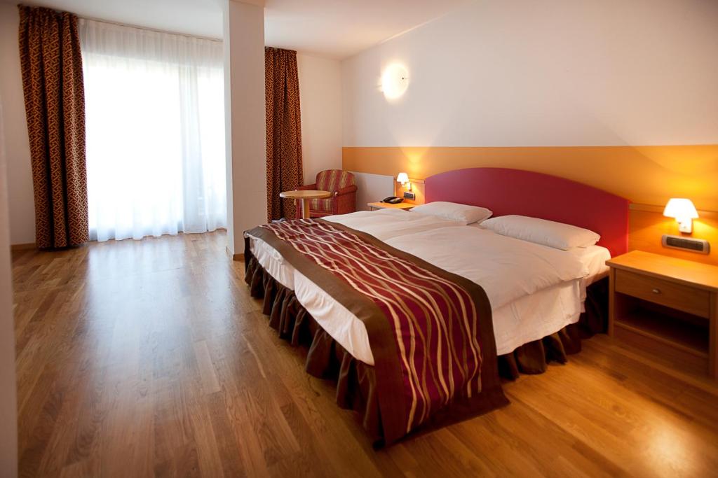 Postel nebo postele na pokoji v ubytování Hotel Baia Verde