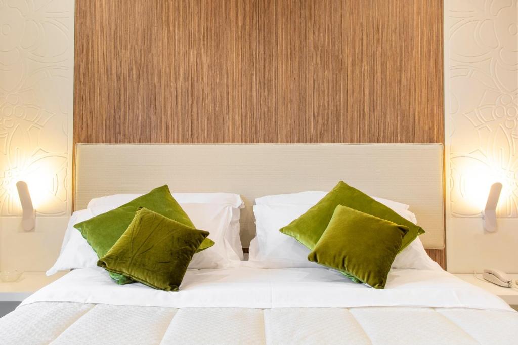 Postel nebo postele na pokoji v ubytování Hotel Miramare