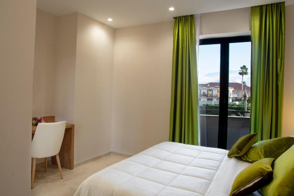Postel nebo postele na pokoji v ubytování Hotel Miramare
