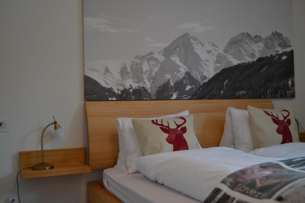Voodi või voodid majutusasutuse Mountain Lodge Sedrun toas
