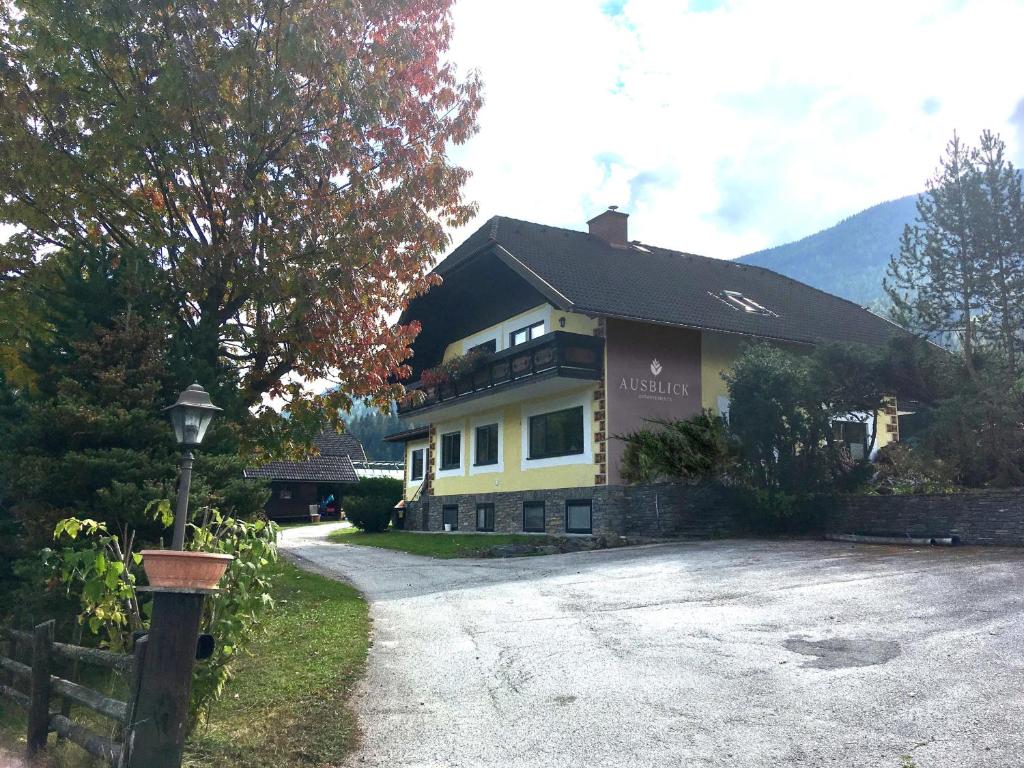 a house with a driveway in front of it at Ausblick Appartements mit Lungaucard in Sankt Michael im Lungau