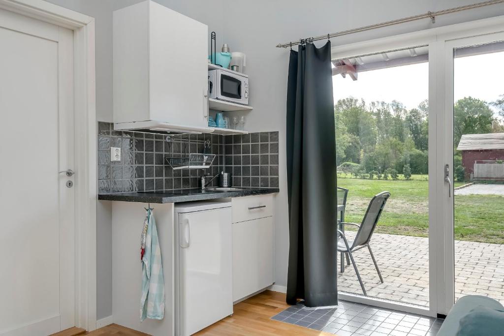 Kuchyň nebo kuchyňský kout v ubytování Ljungs Fem Rum