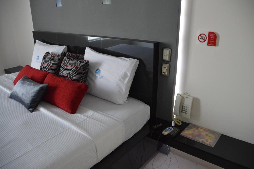 Postel nebo postele na pokoji v ubytování Auto Hotel Mediterráneo