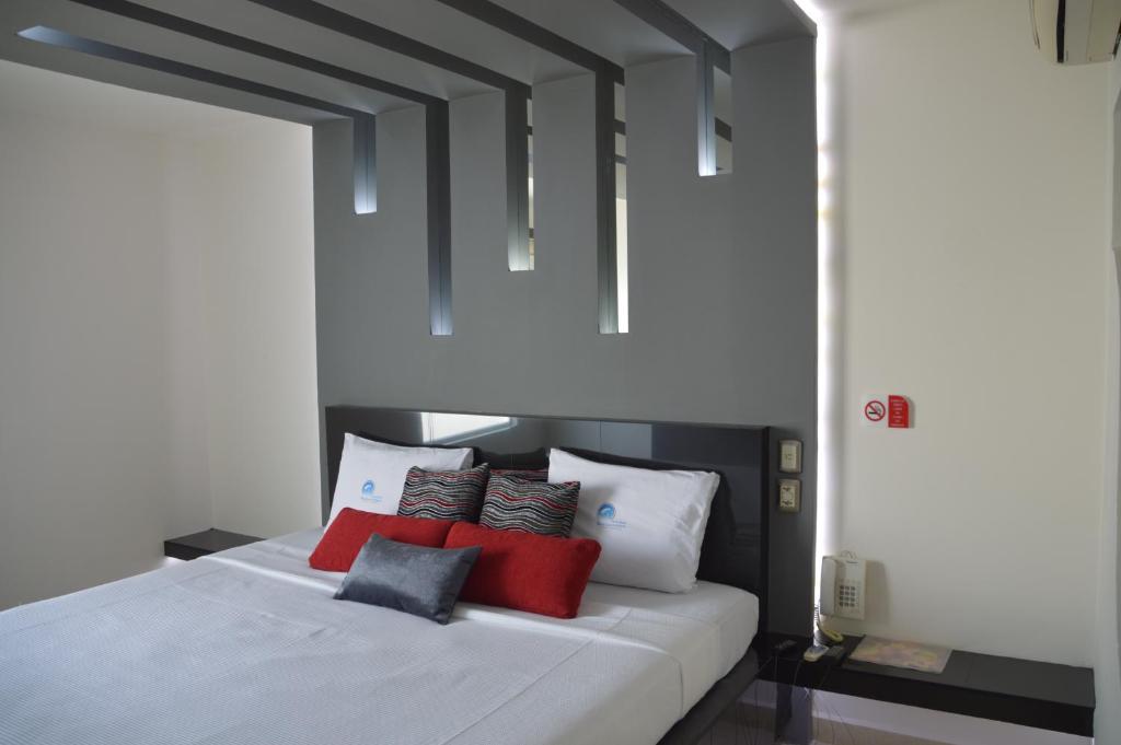 Postel nebo postele na pokoji v ubytování Auto Hotel Mediterráneo